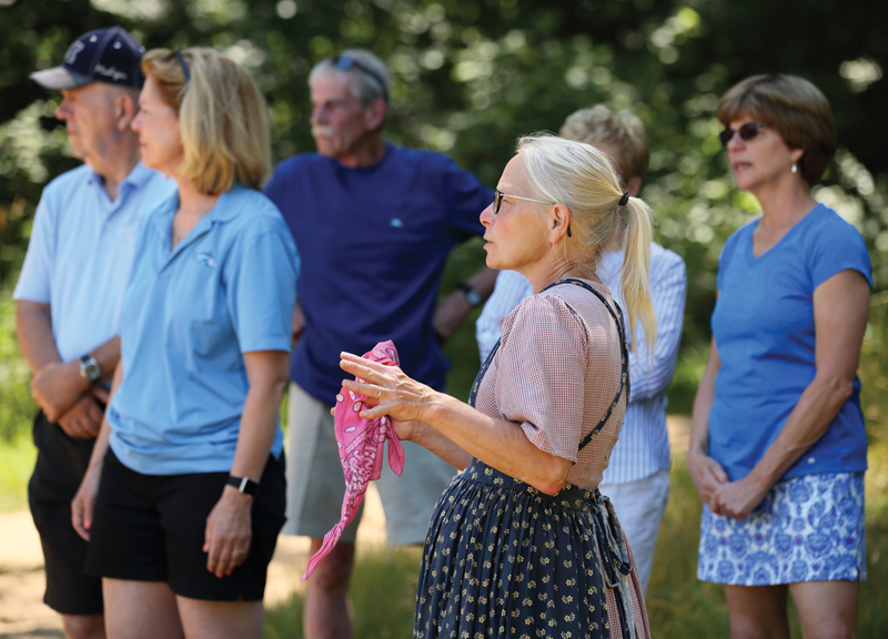 Pleasant Hill Farm owner Joan Donaldson speaks to tour-goers.