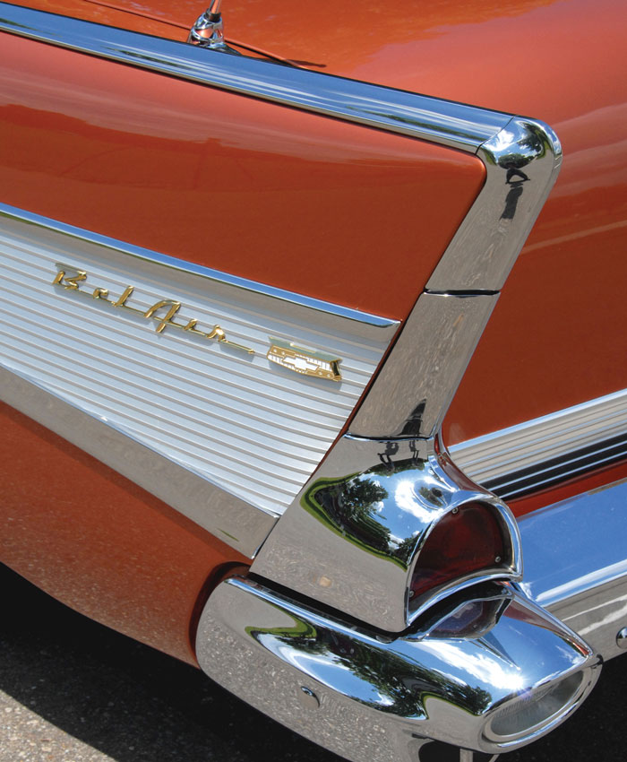 The 1957 Chevy’s chrome detailing and vibrant paint colors