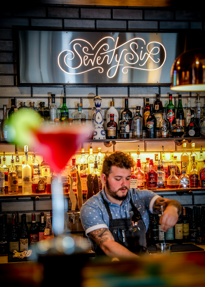 Bartender Tristen Martinie mixes a special cocktail at Seventy-Six.