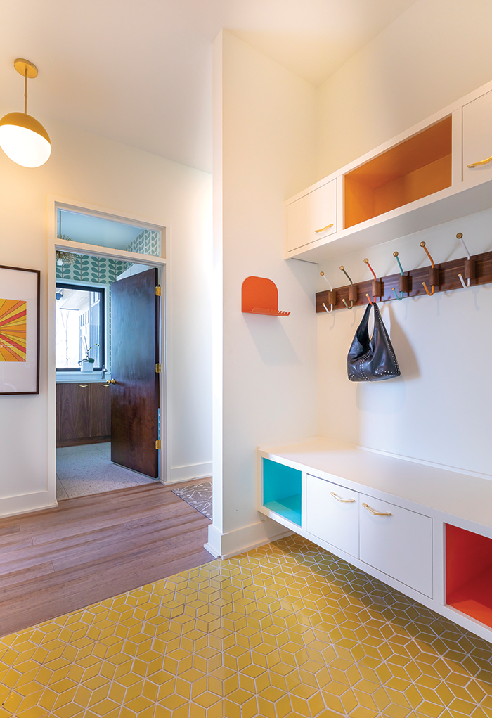 The mudroom’s colors tie in well with the kitchen.