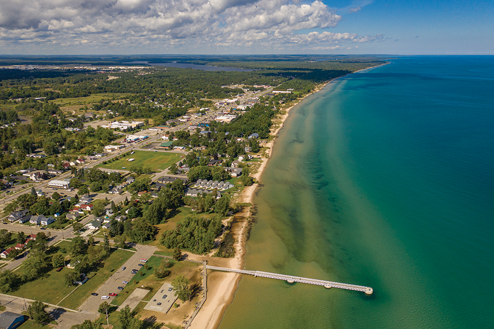 This eagle-eye view looking north highlights the 1,025 feet of Oscoda Beach Park, regarded as one of the state’s top beaches. There’s also the alluring pier and boardwalk along the shoreline.