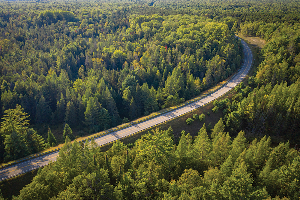 The 23.5-mile River Road National Scenic Byway heads westward from the U.S. 23 Heritage Route in Oscoda and follows the Au Sable River, which flows into Lake Huron. The byway travels through the Huron National Forest.