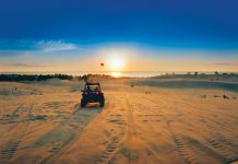 Great Lake Backdrop ORV enthusiasts enjoy a Lake Michigan sunset at Silver Lake Dunes State Park.